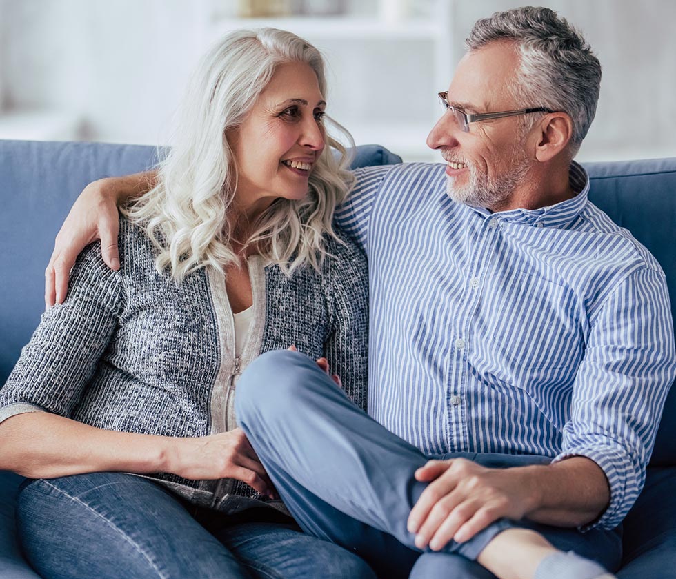 Older couple smiling at each other