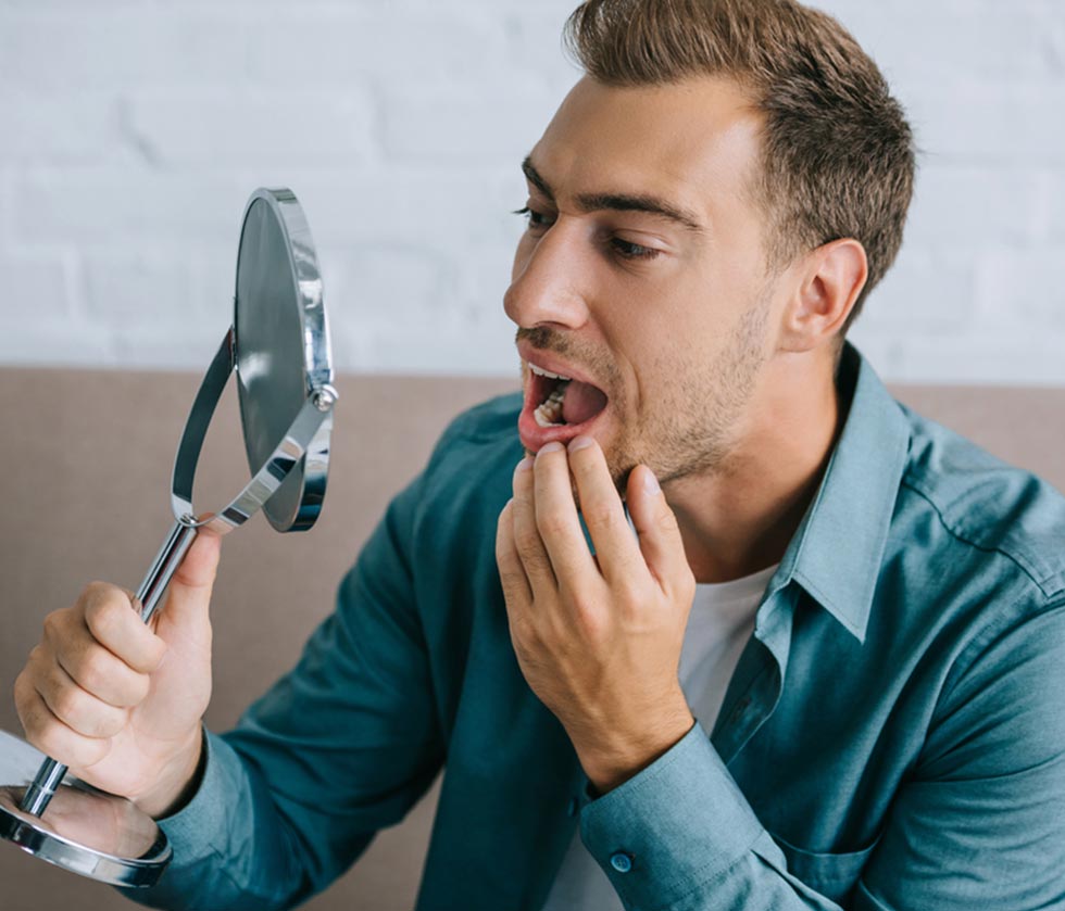 Male experiencing tooth pain